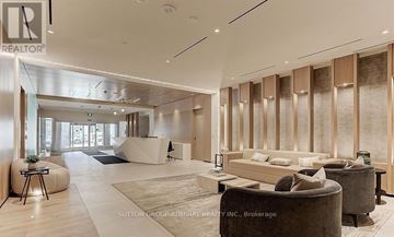 Toronto (Regent Park) condo for rent - A modern living room with a sofa set and a coffee table.