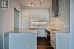 Toronto (Lawrence Park South) condo for rent - A modern kitchen with white cabinets and a marble countertop.