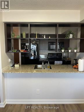 Toronto (Agincourt South-Malvern West) condo for rent - A kitchen with granite countertops and a microwave.