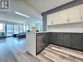 Pickering (Bay Ridges) condo for rent - A modern kitchen with a large island and stainless steel appliances.