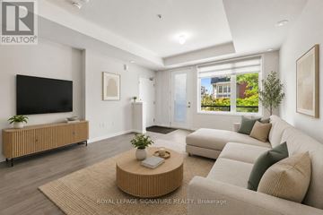 Pickering (Duffin Heights) townhouse for rent - A living room with a flat screen TV, a coffee table, and a couch.
