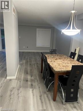 Kitchener townhouse for rent - A dining room with a table and chairs.