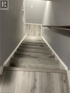 Kitchener townhouse for rent - A staircase with wooden steps and a white railing.