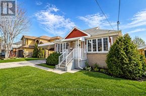 Toronto (Yorkdale-Glen Park) apartment for rent - A house with a red roof and a white porch is for sale.