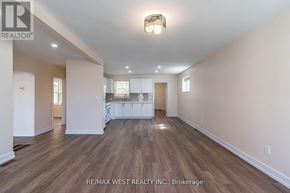 Toronto (Yorkdale-Glen Park) apartment for rent - A spacious room with wooden flooring and white walls.