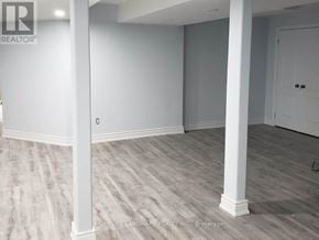 Brampton (Credit Valley) apartment for rent - A room with white pillars and grey carpet.