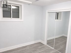 Brampton (Credit Valley) apartment for rent - A room with a white wall and a sliding glass door.