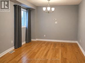 Brampton (Snelgrove) apartment for rent - A room with wooden flooring and a chandelier.