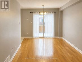 Brampton (Snelgrove) apartment for rent - A room with wooden flooring and a sliding glass door.
