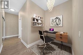 Toronto (Islington-City Centre West) condo for rent - A room with a desk, chair, and a painting on the wall.