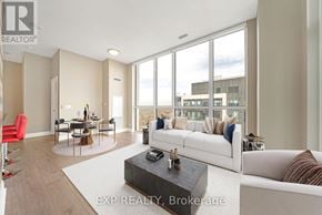 Toronto (Islington-City Centre West) condo for rent - A living room with a white couch and a coffee table.
