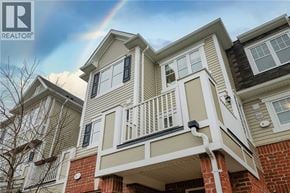 Cambridge townhouse for rent - A house with a balcony and a rainbow in the sky.