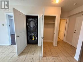 Hamilton (Meadowlands) condo for rent - A laundry room with a washer and dryer in it.