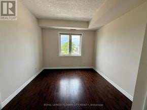Hamilton (Meadowlands) condo for rent - A room with a window and wooden floors.