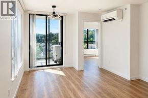 Coquitlam apartment for rent - A room with a sliding glass door leading to a balcony.