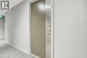 Burlington condo for rent - A glass door with a handle and a number 1310 on it.