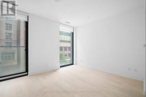 Toronto (Church-Yonge Corridor) condo for rent - A white room with a sliding glass door leading to a balcony.