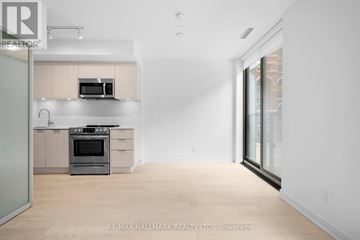 Toronto (Church-Yonge Corridor) condo for rent - A modern kitchen with a stainless steel oven and microwave.