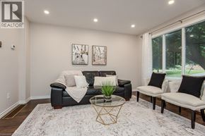 Waterloo apartment for rent - A living room with a black couch and a coffee table.