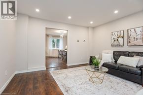 Waterloo apartment for rent - A living room with a black couch and a coffee table.