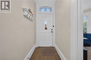Hamilton apartment for rent - A white door with a round doorknob is in a hallway.