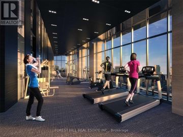Toronto (Mount Pleasant West) condo for rent - A gym with people exercising and a sign that says REALTOR.