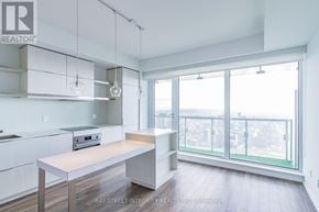 Toronto (Church-Yonge Corridor) condo for rent - A kitchen with white cabinets and a wooden island.