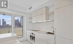 Toronto (Church-Yonge Corridor) condo for rent - A kitchen with white cabinets and a stainless steel oven.