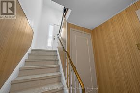 Toronto (Willowdale West) apartment for rent - A staircase with wooden steps and a metal handrail.