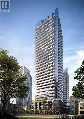 Toronto (Mount Pleasant West) condo for rent - A tall, modern building with a glass facade stands in an urban setting.