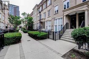 Toronto (Niagara) townhouse for rent - A row of townhouses with a sidewalk in front.