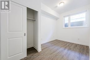 Toronto (Oakridge) townhouse for rent - A room with a white door and a window with blinds.
