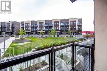 Toronto (Oakridge) townhouse for rent - A view of apartment buildings from a balcony.