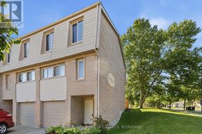 London North (North I) townhouse for rent - A modern house with a brick facade and a garage door.