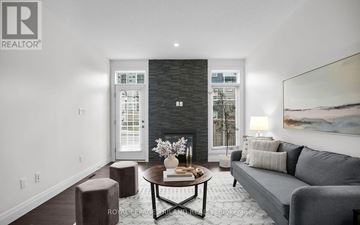 London North (North R) townhouse for rent - A modern living room with a grey couch and a coffee table.