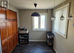 Ottawa townhouse for rent - A room with a desk and a cabinet.