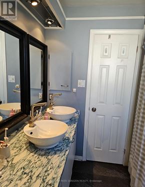 Ottawa townhouse for rent - A bathroom with a sink and mirror.