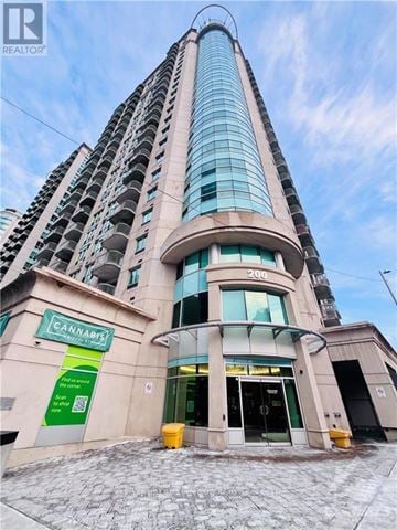 Ottawa condo for rent - A tall building with a Cannabis store on the ground floor.
