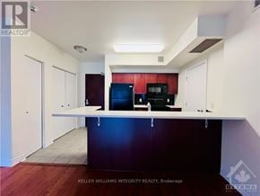 Ottawa condo for rent - A kitchen with a counter and cabinets.