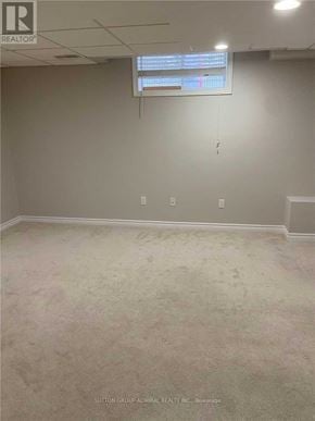Barrie (Northwest) apartment for rent - A room with a carpeted floor and a window with blinds.