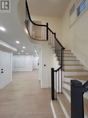 Mississauga (Churchill Meadows) apartment for rent - A staircase with a black railing and beige steps.
