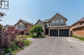 Mississauga (Creditview) multi-family for rent - A large house with a driveway in front of it.
