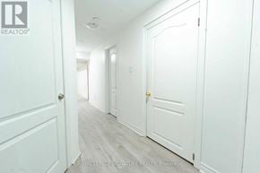 Mississauga (Creditview) multi-family for rent - A hallway with white doors and a logo that says REALTOR.