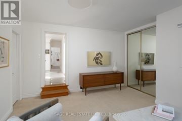 Toronto (Weston) apartment for rent - A living room with a grey sofa and a wooden cabinet.