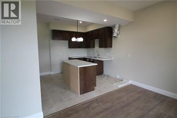 Kitchener townhouse for rent - A kitchen with a wooden island in the middle of the room.