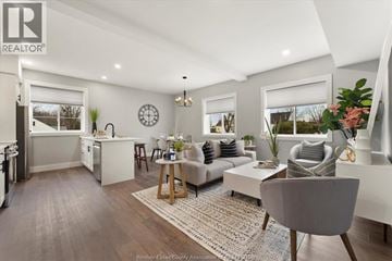 Essex apartment for rent - A well-lit, modern living room with a grey sofa and a wooden coffee table.