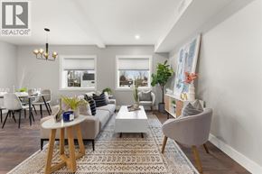 Essex apartment for rent - A well-lit living room with a grey sofa, a wooden coffee table, and a grey armchair.
