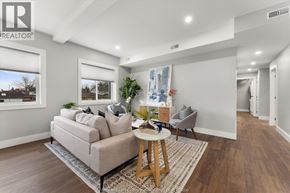 Essex apartment for rent - A living room with a couch, a table, and a painting on the wall.