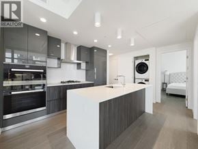 Burnaby apartment for rent - A modern kitchen with a large island in the middle.