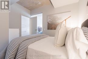 Toronto (Dufferin Grove) condo for rent - A bedroom with a bed and a window.